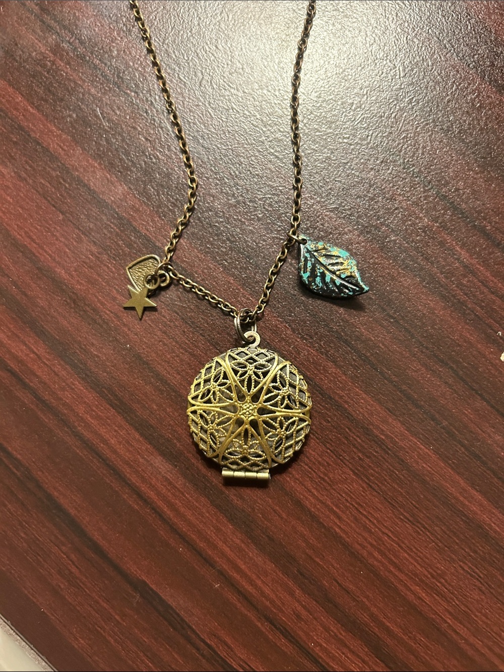 Vintage-Inspired Gold Filigree Locket Necklace with Turquoise Leaf Accent